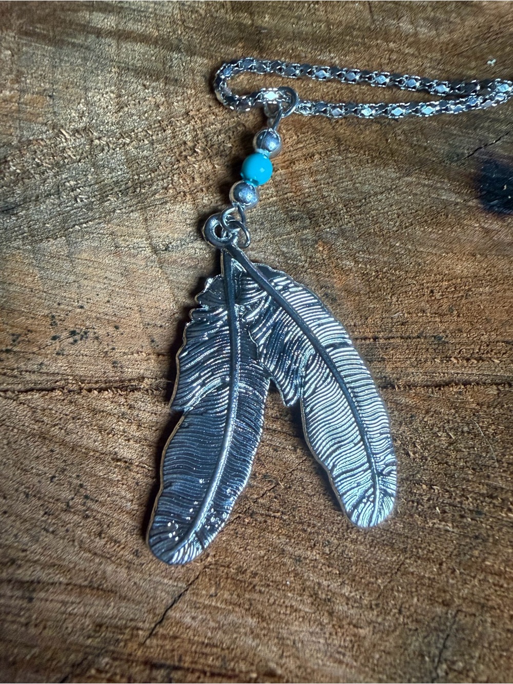 Silver Tone Feather Pendant Necklace with Blue Accent